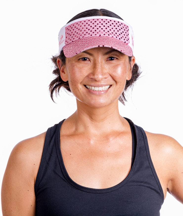 front view of model wearing light pink running visor Sparkle Athletic
