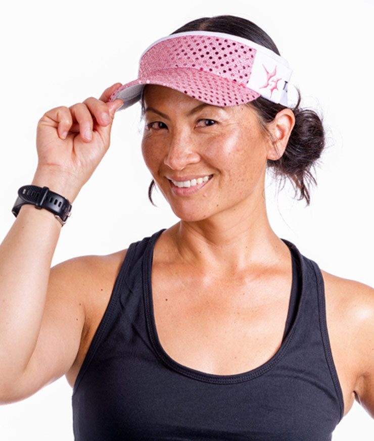 side view of model wearing light pink running visor Sparkle Athletic